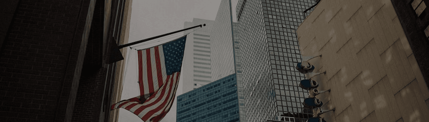 American flag and buildings
